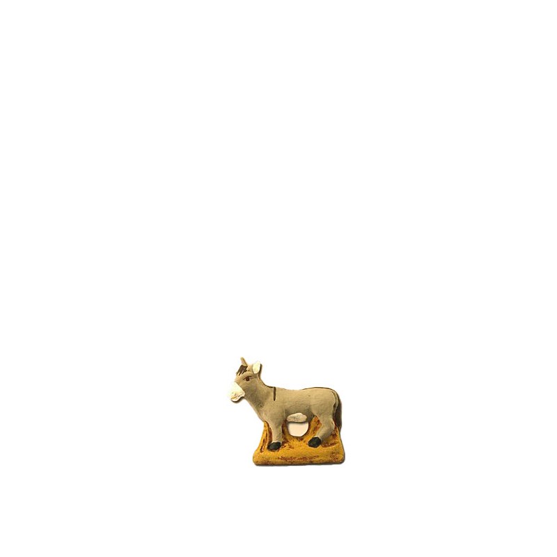 image: Donkey standing on strow