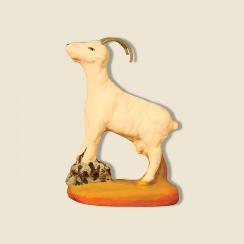 image: Goat standing on a bolder