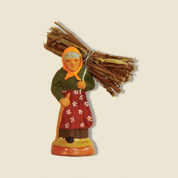 image: Woman carrying wood