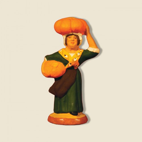 image: Woman carrying pumpkins