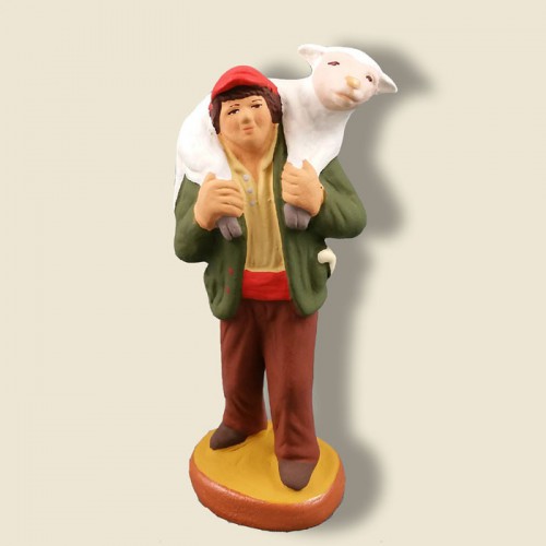image: Farmhand carrying a sheep